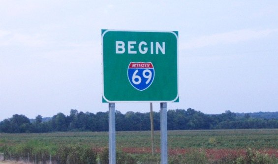 A road sign that says BEGIN 69